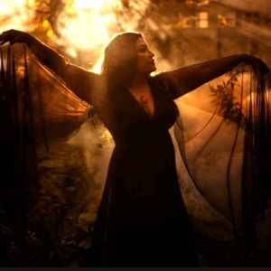 Gothic Glamour Bombshell Gown in black with floor-length sheer cape sleeves.